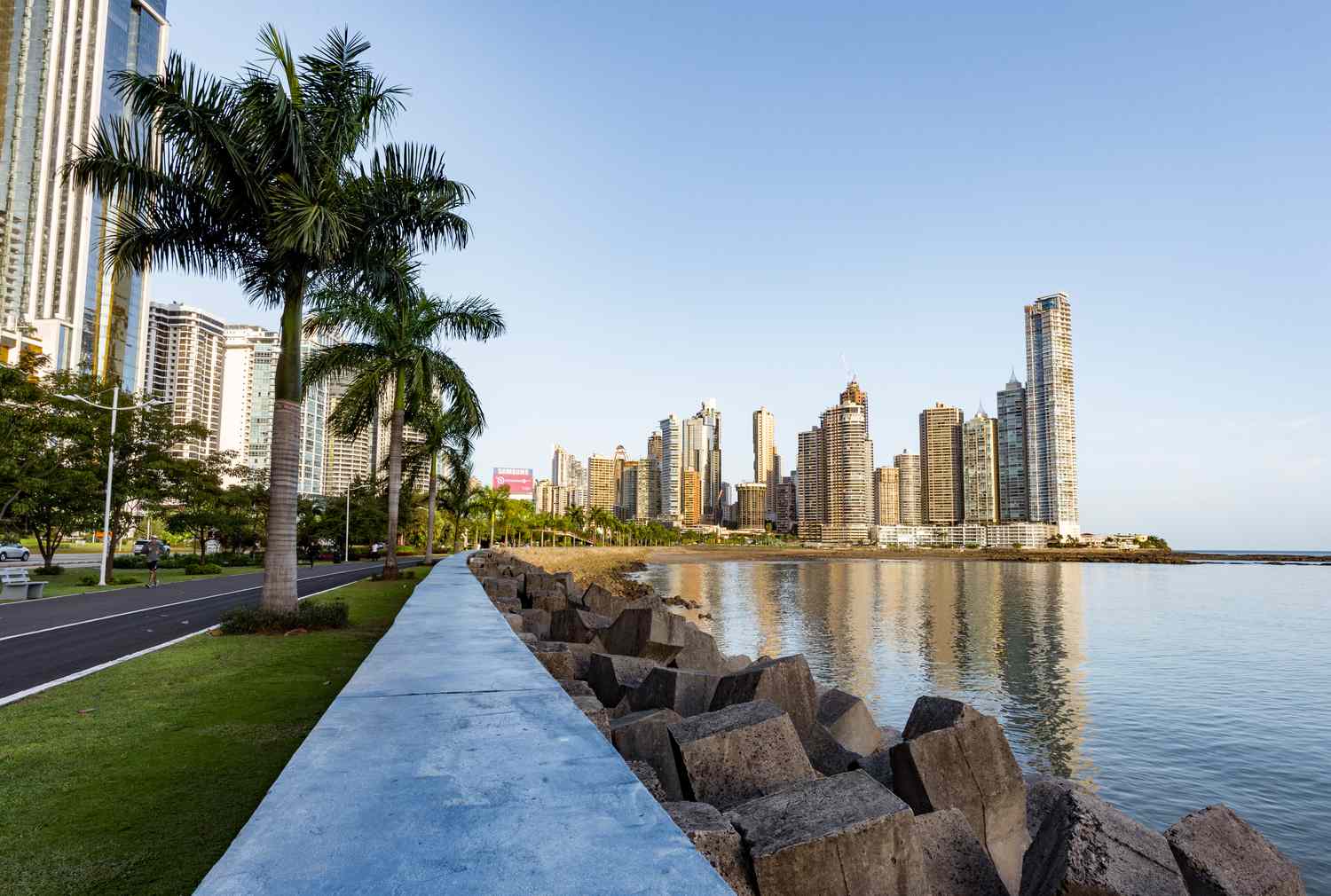 A vibrant cityscape of Panama City, the capital and largest city of Panama, captured from an aerial perspective. The image showcases the city's modern architecture, bustling urban life, and the Panama Canal, a crucial waterway that connects the Atlantic and Pacific Oceans. The city is surrounded by a lush tropical landscape, adding to its charm and allure.